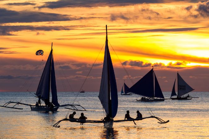 Sunset over the sea and boats, oracay